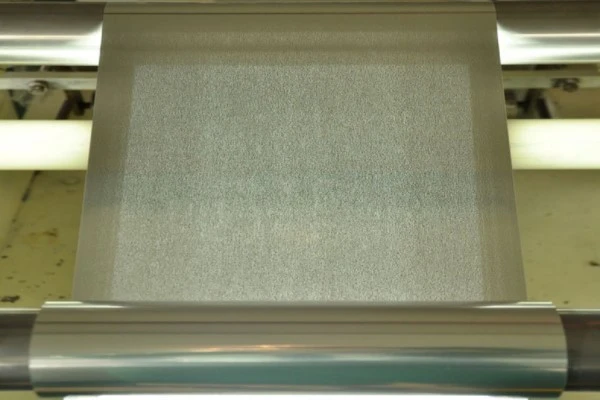 Custom edge-blocking microporous aluminum foil patterns for solid-state battery